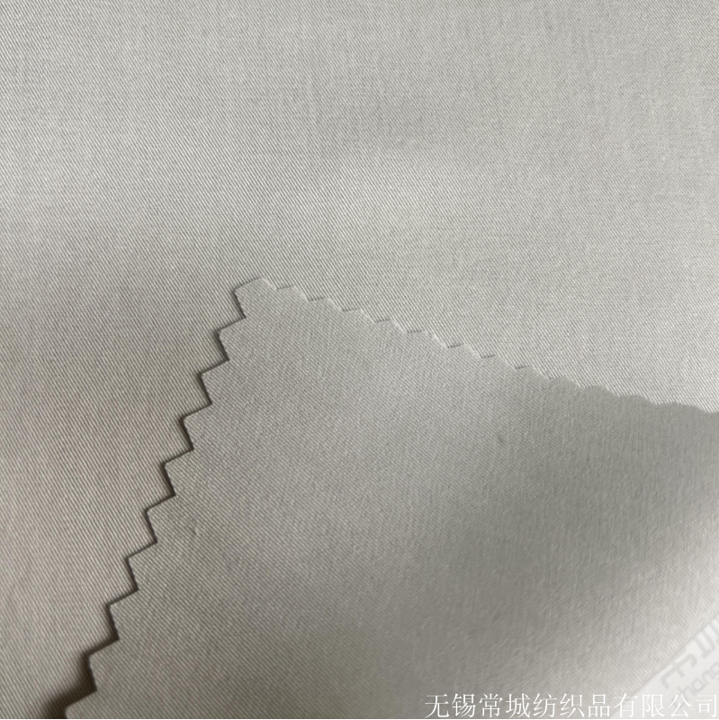 专业厂家直销天丝涤弹细斜纹 微弹不易皱风衣裤装面料