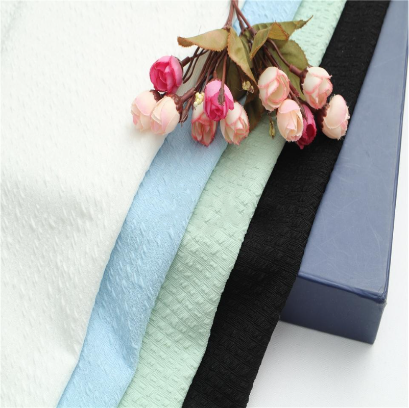 涤氨纶哑光梯格提花布 春秋针织上衣套装面料 时尚休闲服面料